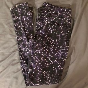 Purple jeans with astrology on them